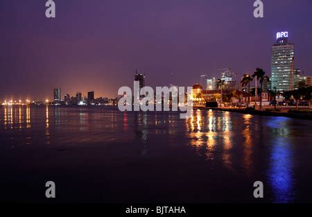 Skyline of capital city Luanda, Luanda bay and seaside promenade with highway during afternoon ...