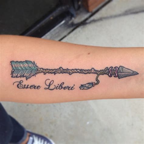 Ancient arrow tattoo with letters on forearm - Tattooimages.biz