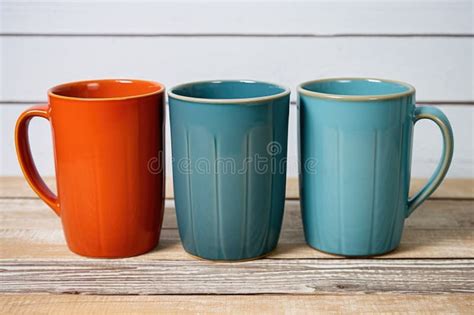 Four Differently Sized Coffee Mugs Set Together Stock Image - Image of ...