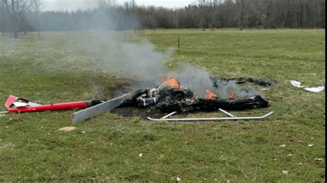 Man rescues pilot from helicopter crash: "He said I'm on fire, put me out."