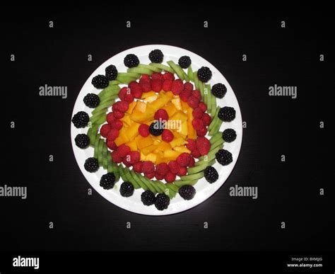 Beautiful Fruit Salad Decoration on Black Background Stock Photo - Alamy