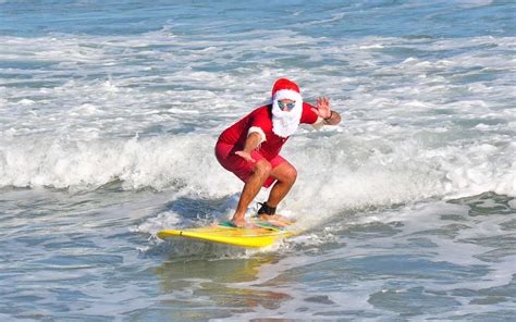 Celebrate Christmas Eve With Hundreds of Surfing Santas on Cocoa Beach | Travel + Leisure