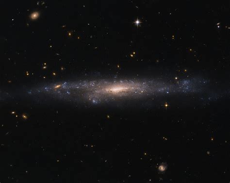 Hubble Sees Galaxy Hiding in the Night Sky | NASA