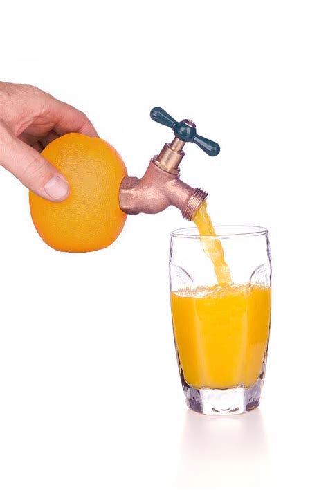 Pouring orange juice Photograph by Joe Belanger - Fine Art America