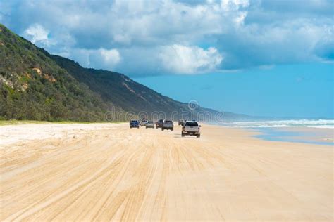 4wd Vehicles at Rainbow Beach with Coloured Sand Dunes, QLD, Australia Editorial Photography ...