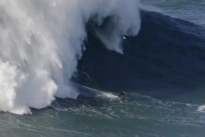 Watch: Surfer takes on 100-foot wave in Portugal - Freaklin