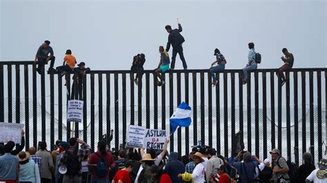 Illegal Caravan Migrants Climb Fence At Southern Border: Where IS The ...