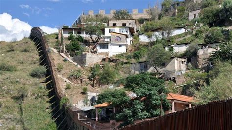 "The wall in Nogales that divides the United States from Mexico. The city of Heroica Nogales ...