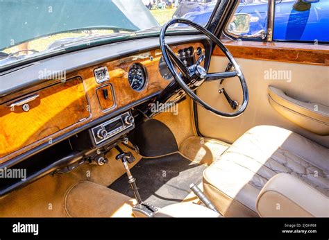 Interior of a a 1970 Austin Princess 1300 Vanden Plas with steering wheel and walnut dashboard ...