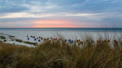 Beach and beach chairs at sunset, Juist … – License image – 70453820 ...