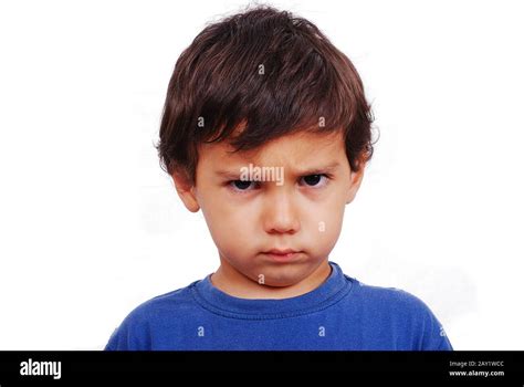 Cute kid with angry expression on his face Stock Photo - Alamy