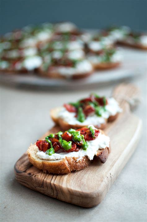 Roasted Tomato Crostini with Basil Pesto - Pretty in Pistachio