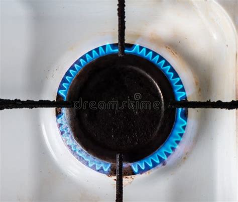 Top View on the Gas Rig with Blue Flames on Old White Kitchen Gas Stove ...