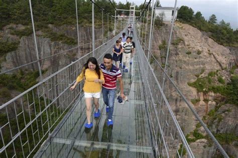 High-altitude Suspension Bridge Made Of Glass Opens In Hunan, China