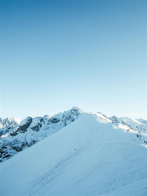 Snow Covered Mountain Under Blue Sky during Daytime · Free Stock Photo