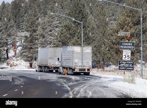 installing snow chains in the California Eastern Sierras in winter ...