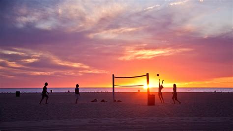 Volleyball on beach, sunset Wallpaper Download 5120x2880