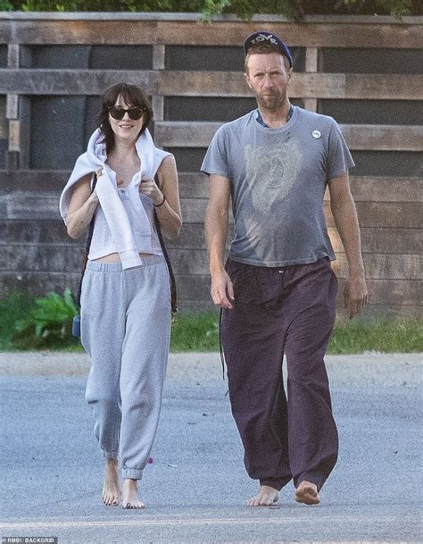 PICTURE EXCLUSIVE: Dakota Johnson wraps arms around boyfriend Chris Martin | Daily Mail Online