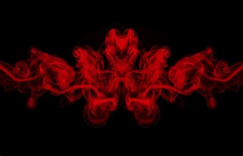 Premium Photo | Art of red smoke abstract on black background, darkness ...