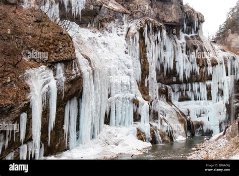 Large frozen icicles on site of waterfalls in mountainous area Stock Photo - Alamy