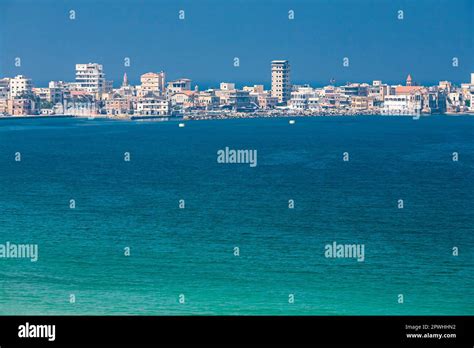 Distant view of old Tyre peninsula(ancient island area), from main land, mediterranean sea, Tyre ...
