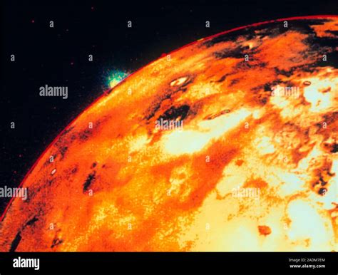 Volcano on Io. An enormous volcanic eruption seen against the blackness ...