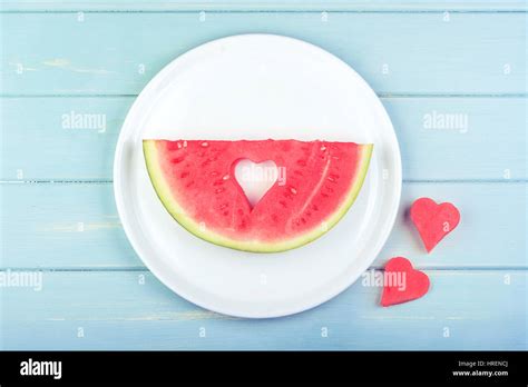 Watermelon with heart-shaped pieces Stock Photo - Alamy