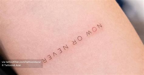 "Now of never" lettering tattoo located on the inner