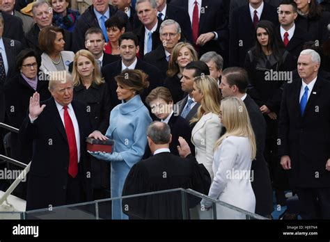 President Donald Trump takes the oath of office from Chief Justice John Roberts as his wife ...