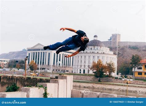 Free Runner Training Parkour Jumping on a Fence while Doing a Back Flip in the Air Stock Image ...