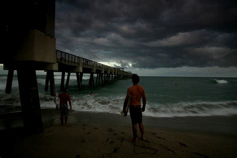 Surfers in the Storm – Juno Beach Pier | HDR Photography by Captain Kimo