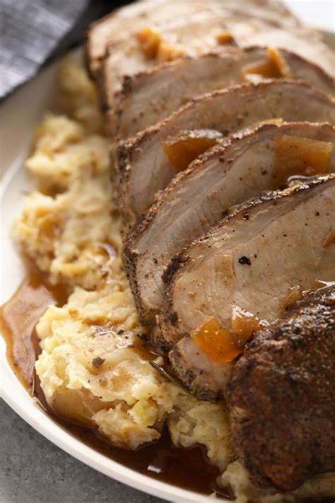 This is the most tender Slow Cooker Pork Loin roast recipe ever! It's served with potatoes ...