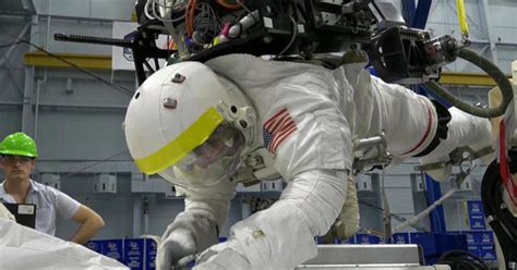 Astronauts conduct challenging spacewalk to fix experiment - CBS News