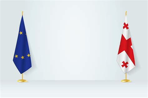 European Union and Georgia flag on indoor flagpole, meeting concept ...