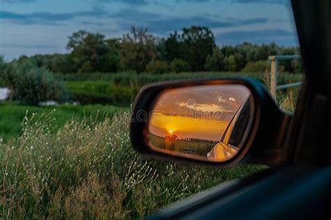 A Golden Sunset Seen in an Outside Rear View Mirror Stock Photo - Image of detail, mirror: 156235328