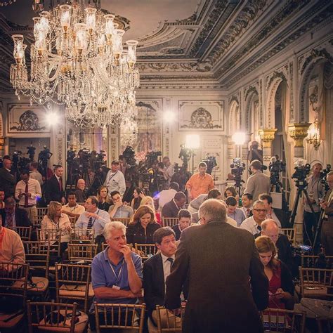 A horde of media gather in the White and Gold Ballroom at Mar-A-Lago in ...