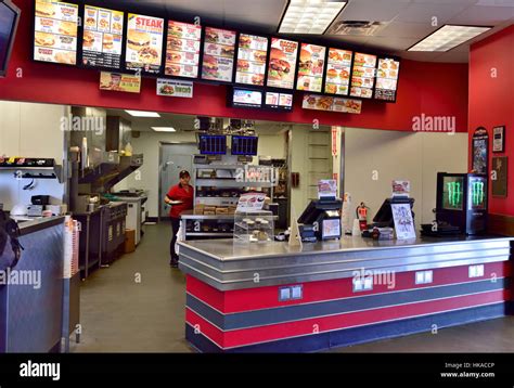 Serving counter inside American fast food restaurant Carl's Jr, Arizona ...