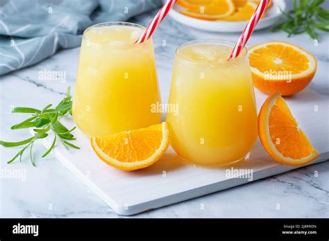 Glass of orange juice with ice. Cold orange fresh. Glass of orange ...