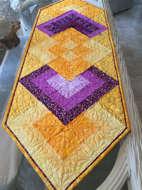 "A beautiful and elegant table runner,quilted with different color threads to compliment each ...