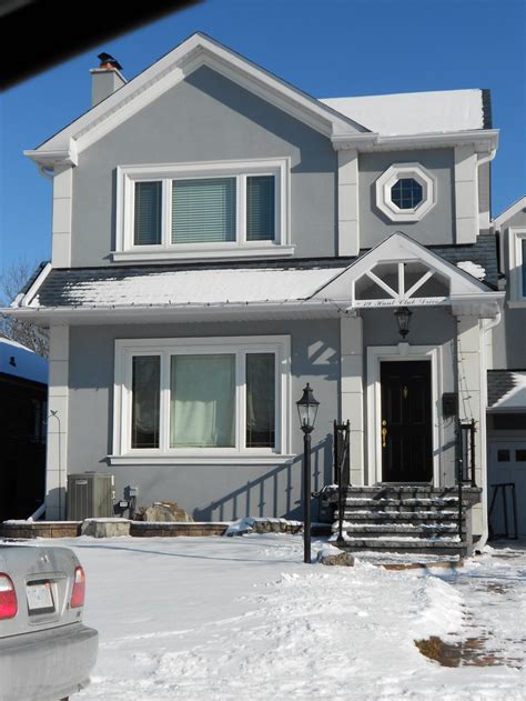 This one's my favourite. I love the grey stucco, the black roof and door, the white embossments ...