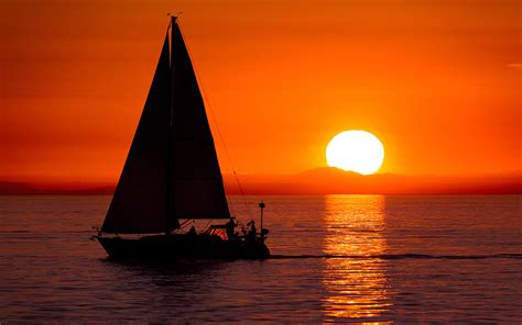 Sailboat Sunset Photograph by Alexis Birkill - Pixels