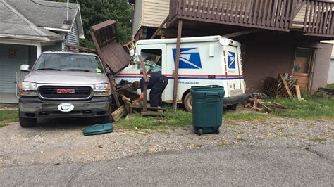 UPDATE: Mail truck crashes into house