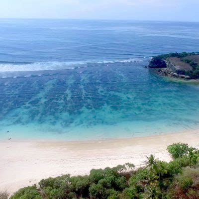 beaches in sumba - beautiful clear preserved ocean in sumba surf camp