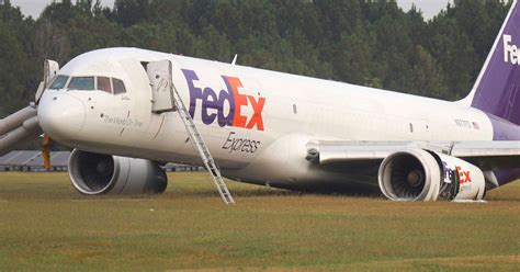 Moment FedEx plane crash lands and skids across runway