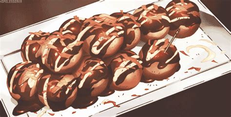 chocolate covered donuts sitting on top of a white tray