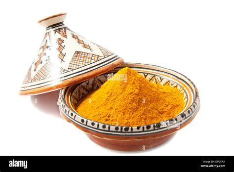 Tajine filled with spices isolated over white Stock Photo - Alamy