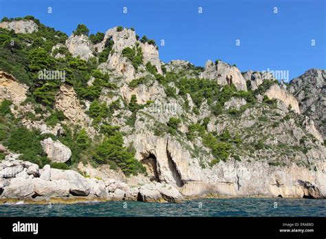 An arch and caves on the coast of Capri island, Italy Stock Photo - Alamy