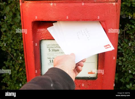 post office letter box red letterbox postbox boxes posting a letter Stock Photo: 63155390 - Alamy