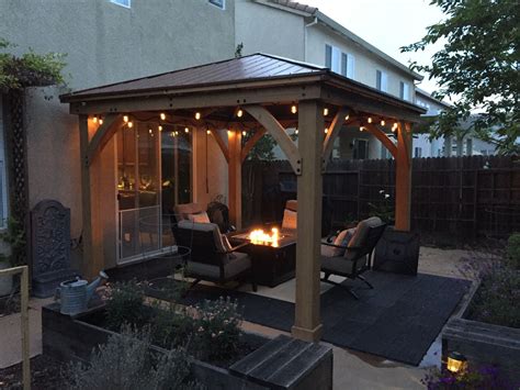 Yardistry 12x12 cedar gazebo from Costco. This thing is amazing. Adds a new dimension to your ...