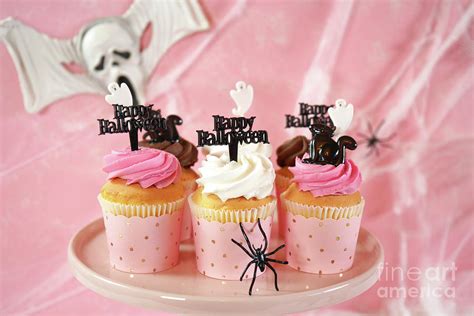 On trend pink Halloween party table with cupcakes Photograph by ...